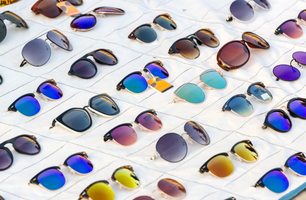 A variety of prescription sunglasses set out for display